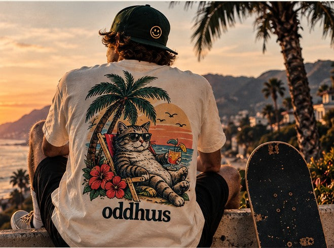 Oddhuus graphic streetwear by the coast at sunset